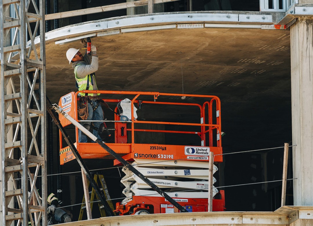 Craft worker in action; Twinbrook Quarter Phase 1 Progress Photography